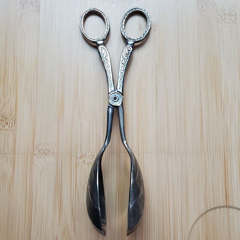 vintage silver plated salad serving tongs wear and patina detailed handle